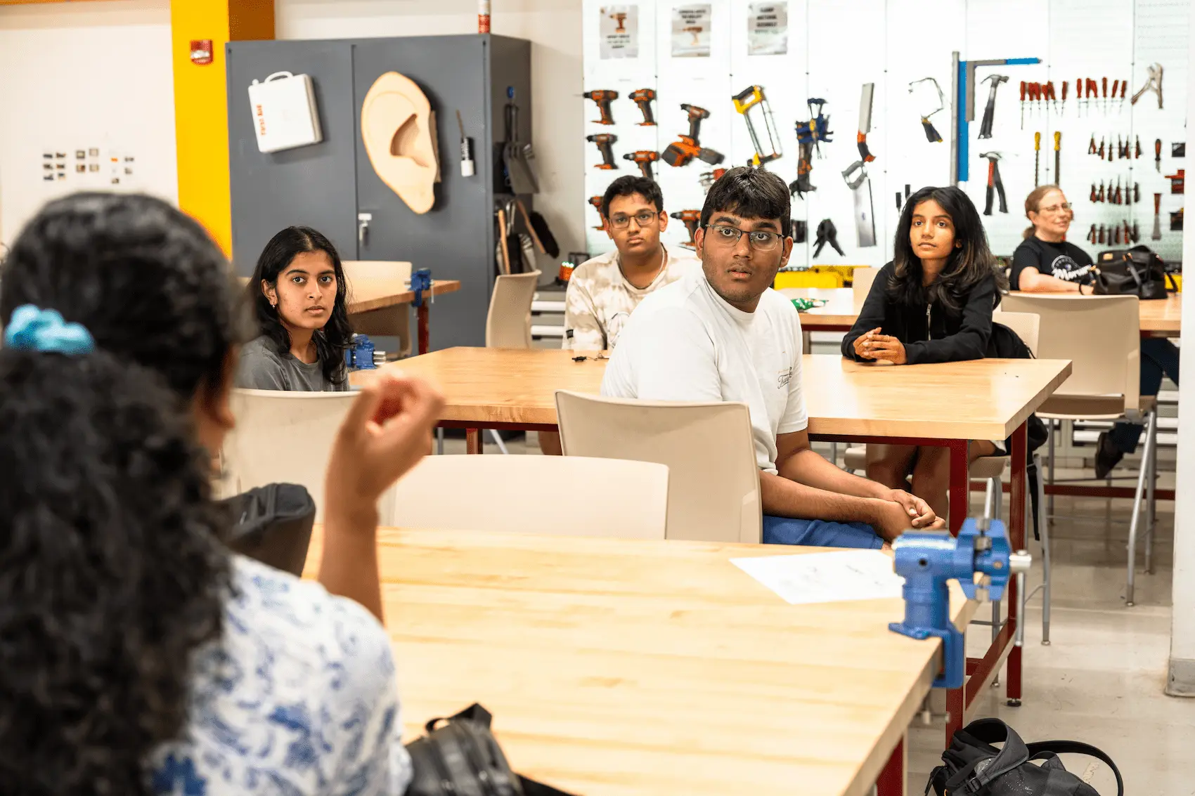 Hackers, mentors, volunteers, and judges collaborating at an Opportunity Hack event